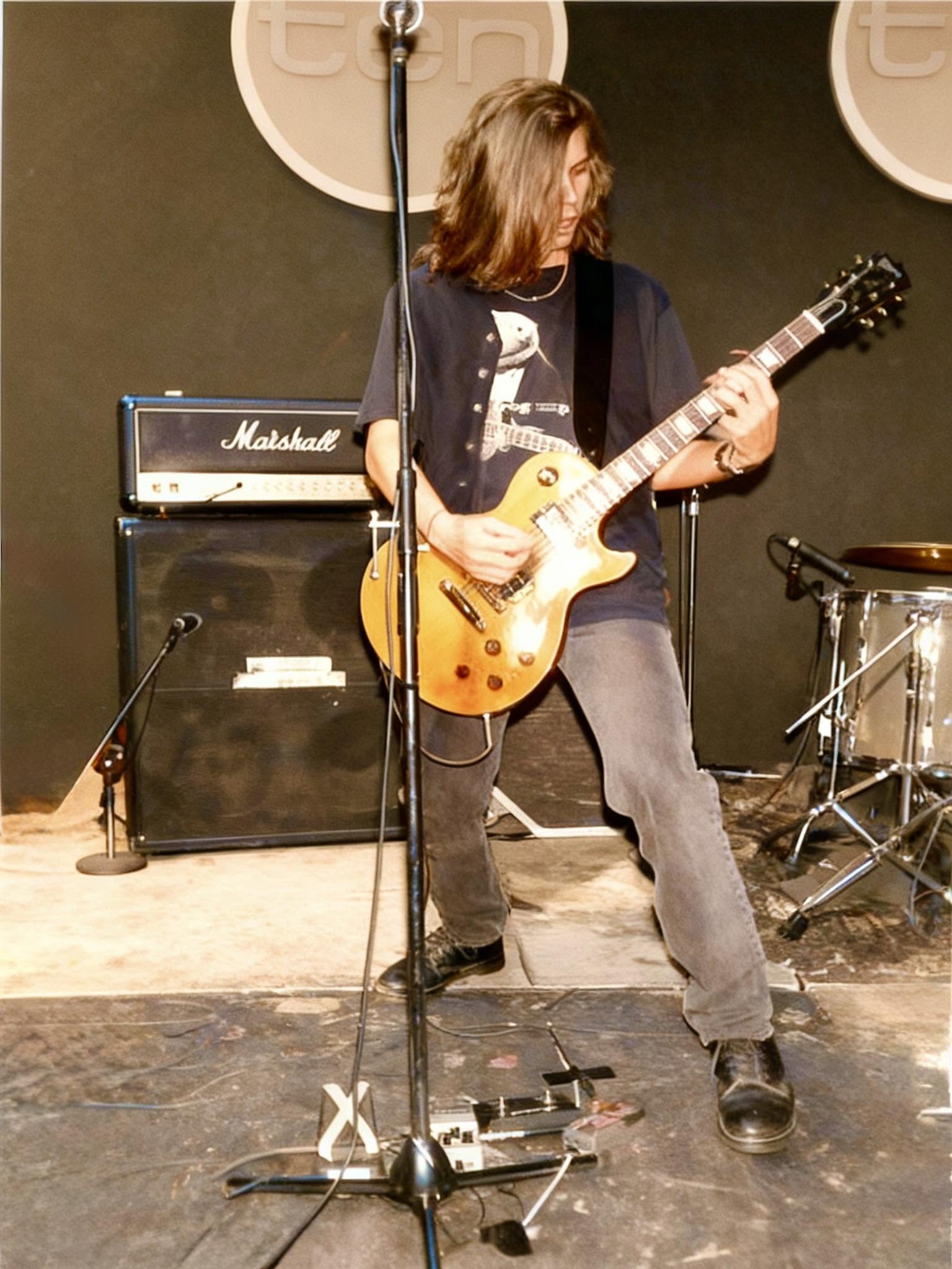Damien performing with Valhalla in the 1990s