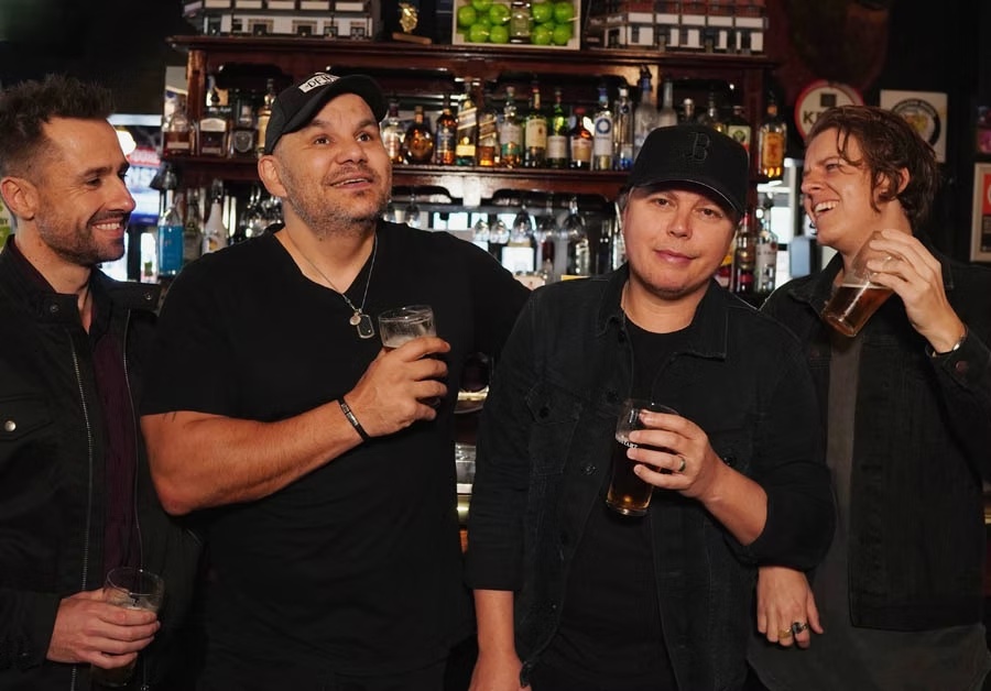 The Viper Creek Band together at a pub